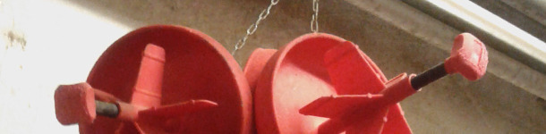 Group of pan feeders hanging from a chain