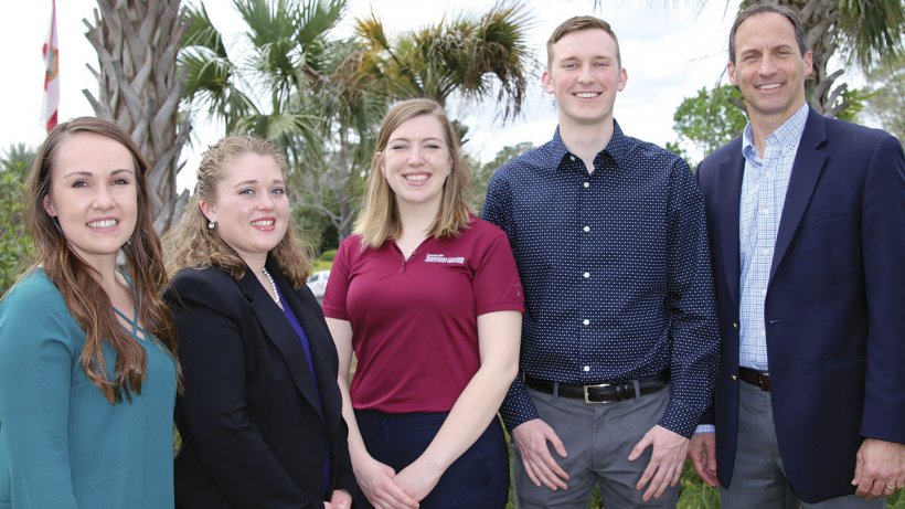 Dr Doug Sullivan (far right) presented scholarships sponsored by Elanco Animal Health. Recipients of the $2500 AASV Foundation scholarships were (from left): Erin Kettelkamp, University of Illinois; Marjorie Schleper, University of Minnesota; Enise DeCaluwe-Tulk, University of Guelph; and Sam Baker, Iowa State University
