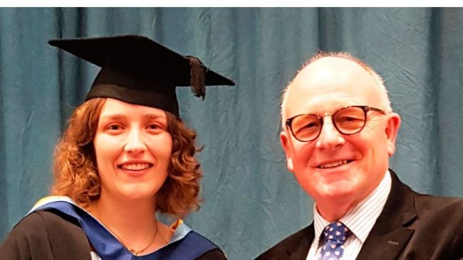 Olivia Hartshorn being presented with the Nick Bird Award by Farmex managing director, Hugh Crabtree, at a ceremony at Harper Adams University.