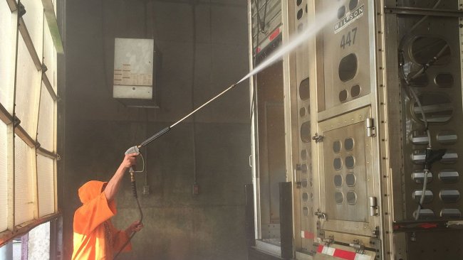 Photo 2. Power washing of a truck exterior.