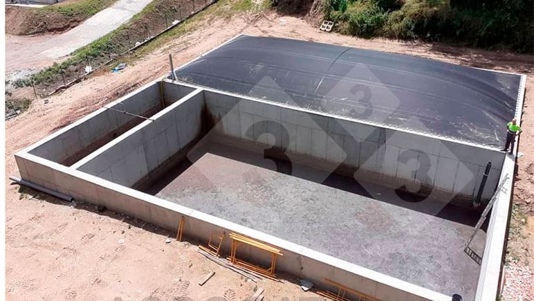 Photo 1: Aerial view of the existing rope structure under the propylene tarp. Photo 2: Aerial view of the biogas plant which consists of a reception area for fresh slurry, anaerobic digestion area, and digestate storage area.
