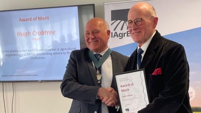 Hugh Crabtree (right) is presented with the Award of Merit by Steve Constable, president, Institution of Agricultural Engineers, at a special ceremony held at Amazone Ltd, Doncaster. (Photo: Marion King)