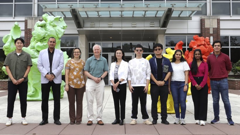 Brian Cunningham, Intel Alumni Endowed Chair of Electrical and Computer Engineering, and Ying Fang, professor of pathobiology in the College of Veterinary Medicine (center) and lab members to develop portable point-of-use biosensor for detection of African swine fever virus in farm environments.
