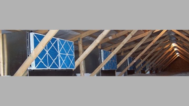 Image of the attic with filter boxes in a sows' farm adapted to the air filtering system.